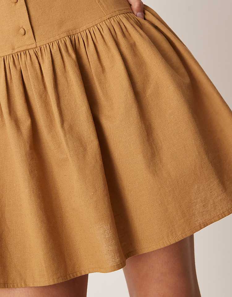 https://images.asos-media.com/products/asos-design-slash-neck-button-down-dropped-waist-mini-dress-in-tan/207520617-4?$n_750w$&wid=750&fit=constrain