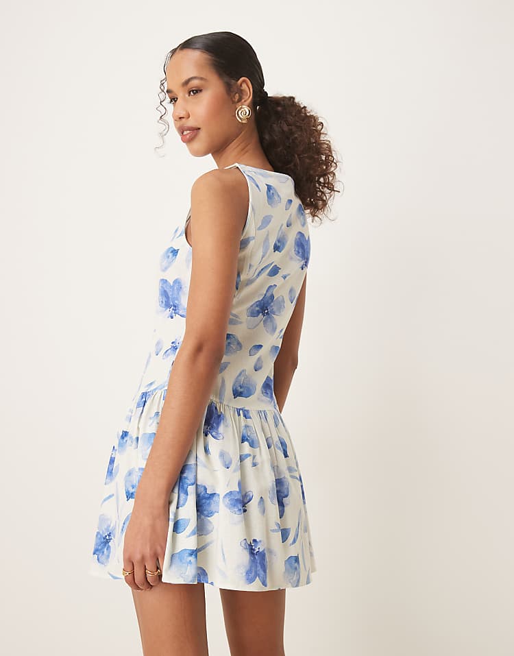 https://images.asos-media.com/products/asos-design-slash-neck-button-down-dropped-waist-mini-dress-in-blue-painted-print/208116435-3?$n_750w$&wid=750&fit=constrain