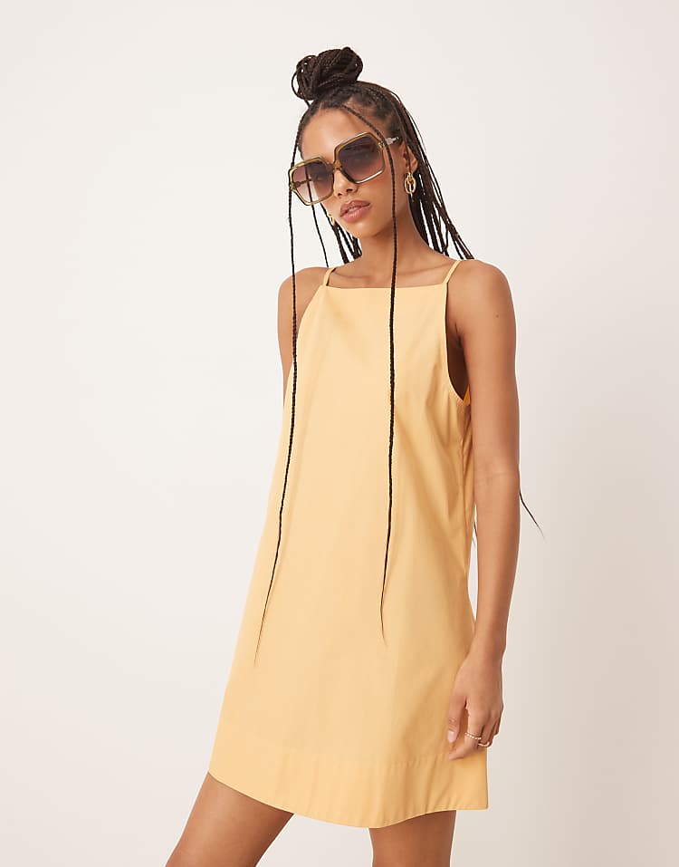 https://images.asos-media.com/products/asos-design-slash-neck-shapeless-mini-in-golden-sand/208283225-4?$n_750w$&wid=750&fit=constrain