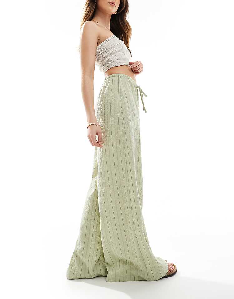 https://images.asos-media.com/products/stradivarius-linen-look-wide-leg-trouser-in-khaki-stripe/208312256-5?$n_750w$&wid=750&fit=constrain