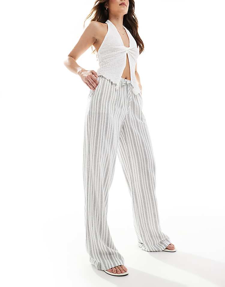 https://images.asos-media.com/products/stradivarius-linen-look-pull-on-crinkle-trouser-in-stripe/208312403-1-multi?$n_750w$&wid=750&fit=constrain