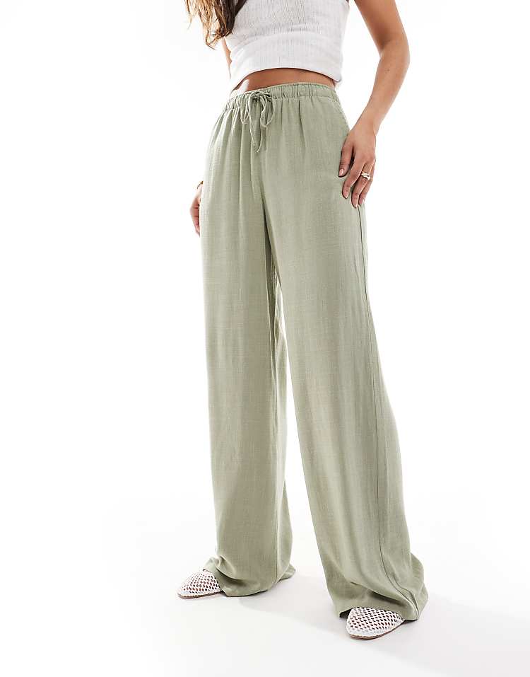 https://images.asos-media.com/products/stradivarius-linen-look-pull-on-trouser-in-khaki/208361860-4?$n_750w$&wid=750&fit=constrain