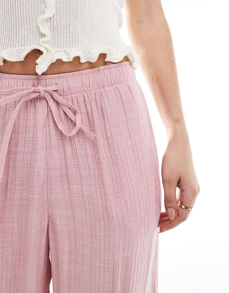 https://images.asos-media.com/products/stradivarius-linen-look-pull-on-crinkle-trouser-in-pink/208361863-4?$n_750w$&wid=750&fit=constrain