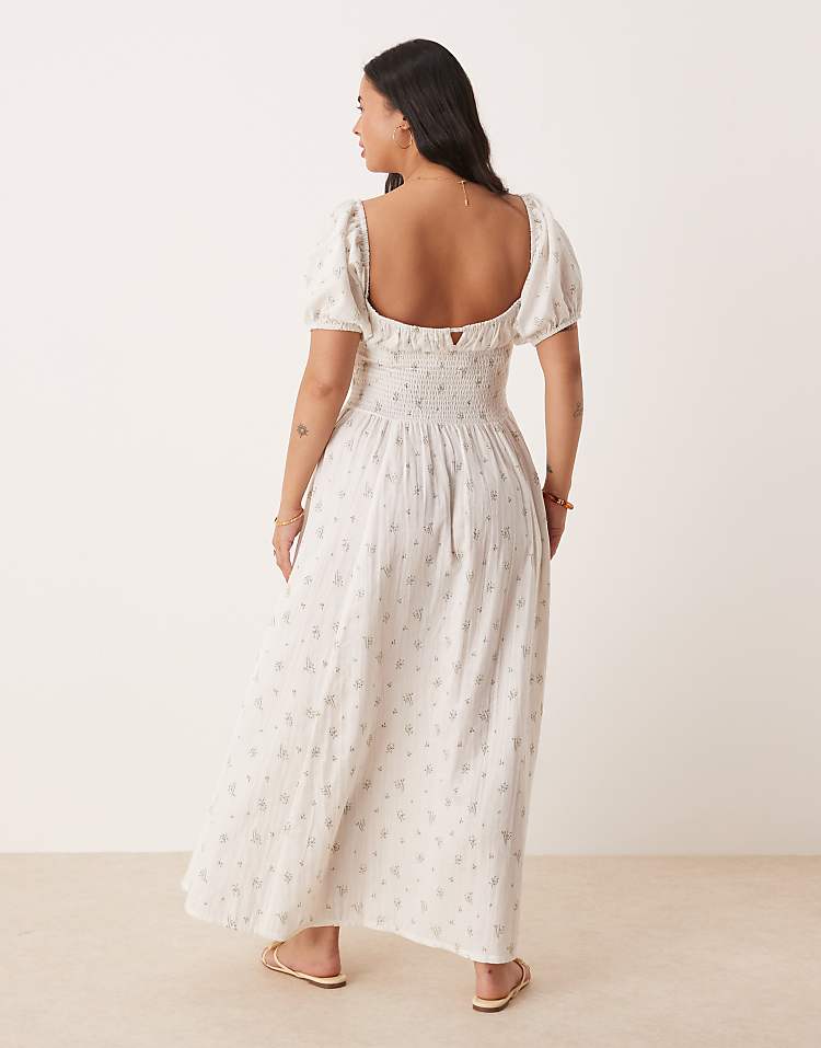 https://images.asos-media.com/products/esmee-curve-exclusive-puff-sleeve-tie-front-maxi-beach-dress-in-white-ditsy-floral/208556487-2?$n_750w$&wid=750&fit=constrain