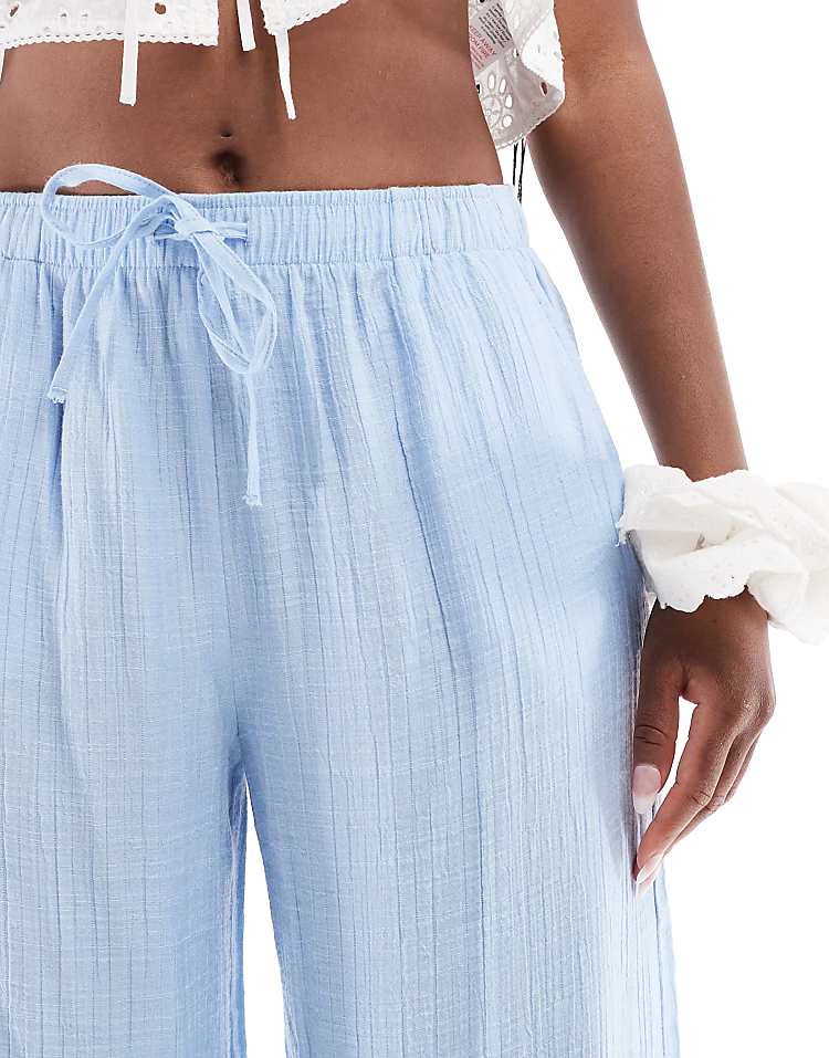 https://images.asos-media.com/products/stradivarius-linen-look-pull-on-crinkle-trouser-in-blue/208635333-4?$n_750w$&wid=750&fit=constrain
